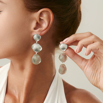 Fashion Metal Texture Glossy Earrings showcasing pleated irregular geometry design with a shiny silver finish.