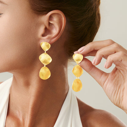 Fashion Metal Texture Glossy Earrings showcasing pleated irregular geometry design with a shiny silver finish.