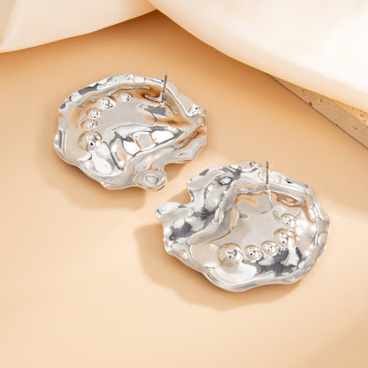 Fashion Metal Texture Glossy Earrings showcasing pleated irregular geometry design with a shiny silver finish.
